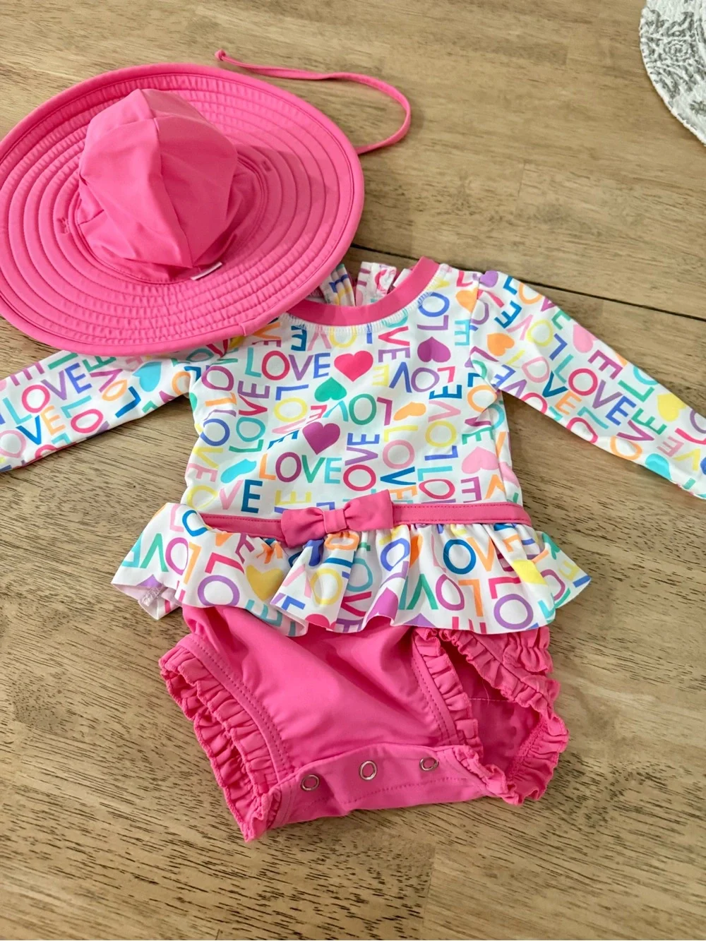 Rufflebutts rash guard and hat. 3/6